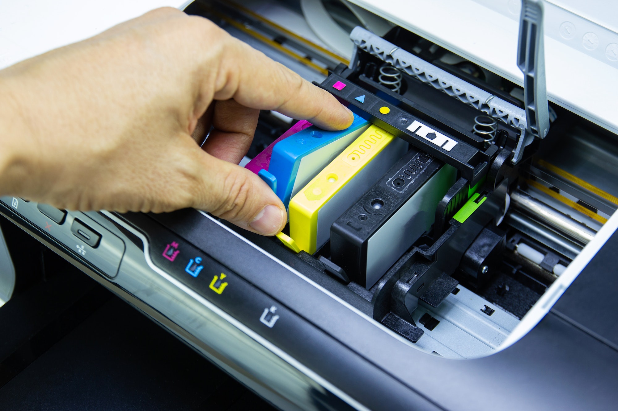 Technicians are install setup the ink cartridge or inkjet cartridge is a component of an inkjet prin
